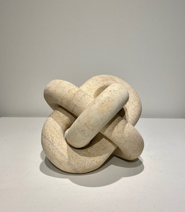 Carved natural stone knot sculpture